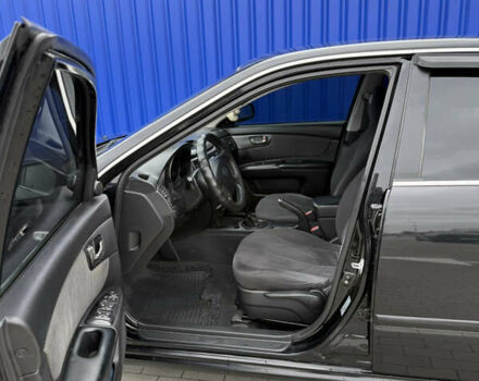 Чорний Кіа Маджентіс, об'ємом двигуна 2 л та пробігом 170 тис. км за 6300 $, фото 9 на Automoto.ua