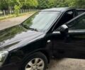 Черный Киа Маджентис, объемом двигателя 2 л и пробегом 302 тыс. км за 4500 $, фото 1 на Automoto.ua