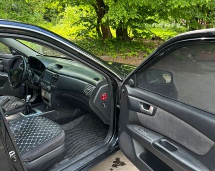 Черный Киа Маджентис, объемом двигателя 2 л и пробегом 300 тыс. км за 4501 $, фото 1 на Automoto.ua