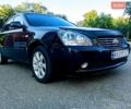Черный Киа Маджентис, объемом двигателя 2 л и пробегом 217 тыс. км за 3800 $, фото 1 на Automoto.ua