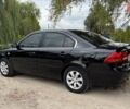 Черный Киа Маджентис, объемом двигателя 2 л и пробегом 299 тыс. км за 5199 $, фото 1 на Automoto.ua