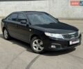Черный Киа Маджентис, объемом двигателя 2 л и пробегом 225 тыс. км за 5799 $, фото 1 на Automoto.ua