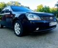 Чорний Кіа Маджентіс, об'ємом двигуна 2 л та пробігом 217 тис. км за 3800 $, фото 1 на Automoto.ua