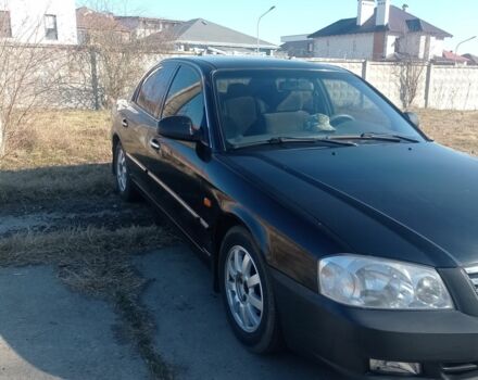 Черный Киа Маджентис, объемом двигателя 2 л и пробегом 350 тыс. км за 3500 $, фото 1 на Automoto.ua