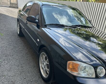 Чорний Кіа Маджентіс, об'ємом двигуна 2 л та пробігом 460 тис. км за 4500 $, фото 1 на Automoto.ua