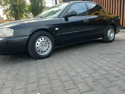 Чорний Кіа Маджентіс, об'ємом двигуна 1.99 л та пробігом 195 тис. км за 3200 $, фото 1 на Automoto.ua