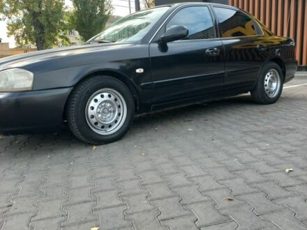 Черный Киа Маджентис, объемом двигателя 2 л и пробегом 195 тыс. км за 3500 $, фото 1 на Automoto.ua