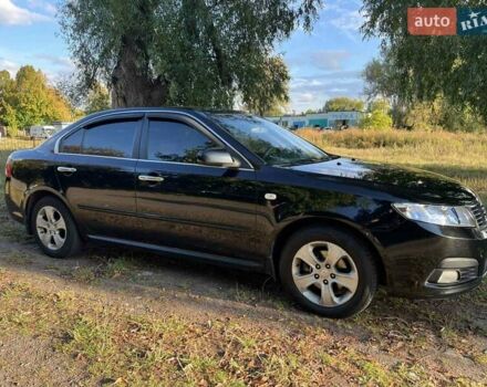 Чорний Кіа Маджентіс, об'ємом двигуна 2 л та пробігом 227 тис. км за 5650 $, фото 1 на Automoto.ua