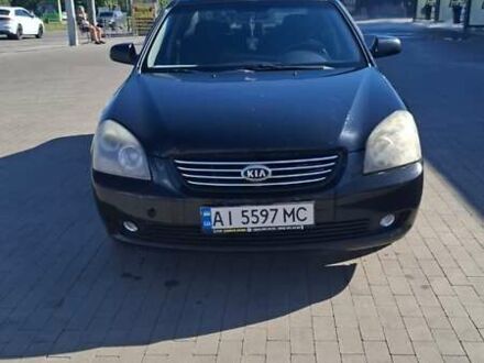 Чорний Кіа Маджентіс, об'ємом двигуна 2 л та пробігом 264 тис. км за 4500 $, фото 1 на Automoto.ua