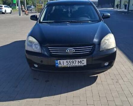 Чорний Кіа Маджентіс, об'ємом двигуна 2 л та пробігом 264 тис. км за 4500 $, фото 1 на Automoto.ua