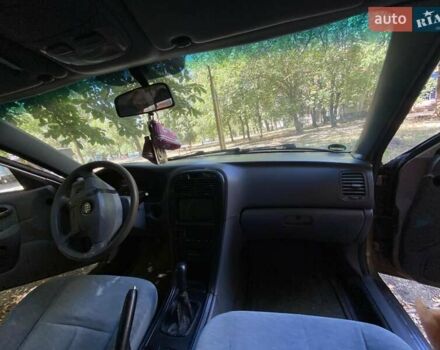 Коричневий Кіа Маджентіс, об'ємом двигуна 2 л та пробігом 160 тис. км за 3000 $, фото 2 на Automoto.ua