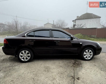 Коричневий Кіа Маджентіс, об'ємом двигуна 2 л та пробігом 157 тис. км за 5900 $, фото 9 на Automoto.ua