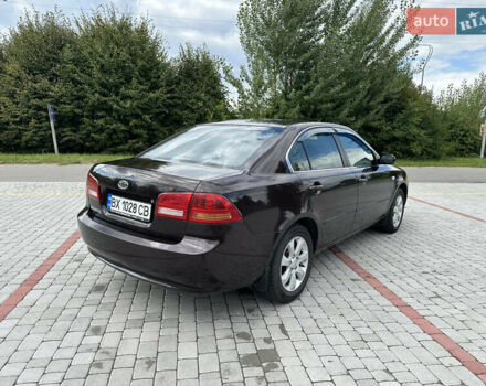 Коричневий Кіа Маджентіс, об'ємом двигуна 2 л та пробігом 255 тис. км за 5500 $, фото 4 на Automoto.ua