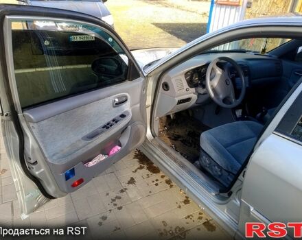 Сірий Кіа Маджентіс, об'ємом двигуна 2 л та пробігом 260 тис. км за 4100 $, фото 4 на Automoto.ua