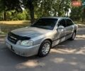 Серый Киа Маджентис, объемом двигателя 2 л и пробегом 265 тыс. км за 3300 $, фото 1 на Automoto.ua