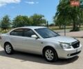Сірий Кіа Маджентіс, об'ємом двигуна 2 л та пробігом 280 тис. км за 5500 $, фото 1 на Automoto.ua