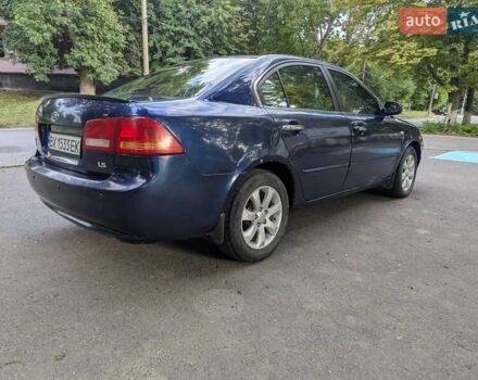 Синій Кіа Маджентіс, об'ємом двигуна 2 л та пробігом 259 тис. км за 3600 $, фото 4 на Automoto.ua