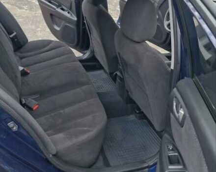 Синій Кіа Маджентіс, об'ємом двигуна 2 л та пробігом 110 тис. км за 5700 $, фото 7 на Automoto.ua