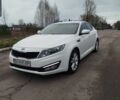 Білий Кіа Оптіма, об'ємом двигуна 2 л та пробігом 195 тис. км за 10350 $, фото 1 на Automoto.ua