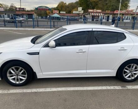 Белый Киа Оптима, объемом двигателя 2 л и пробегом 290 тыс. км за 6999 $, фото 1 на Automoto.ua