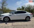 Белый Киа Оптима, объемом двигателя 2 л и пробегом 174 тыс. км за 10000 $, фото 1 на Automoto.ua