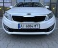 Белый Киа Оптима, объемом двигателя 2 л и пробегом 150 тыс. км за 9800 $, фото 1 на Automoto.ua