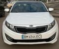 Белый Киа Оптима, объемом двигателя 2 л и пробегом 230 тыс. км за 9099 $, фото 1 на Automoto.ua