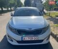 Білий Кіа Оптіма, об'ємом двигуна 2 л та пробігом 286 тис. км за 10500 $, фото 1 на Automoto.ua