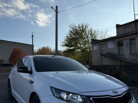 Белый Киа Оптима, объемом двигателя 2 л и пробегом 125 тыс. км за 9400 $, фото 1 на Automoto.ua