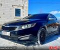 Черный Киа Оптима, объемом двигателя 2 л и пробегом 145 тыс. км за 10000 $, фото 1 на Automoto.ua