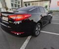 Черный Киа Оптима, объемом двигателя 2.36 л и пробегом 182 тыс. км за 11300 $, фото 1 на Automoto.ua