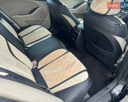 Черный Киа Оптима, объемом двигателя 2.36 л и пробегом 252 тыс. км за 11000 $, фото 10 на Automoto.ua