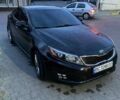 Черный Киа Оптима, объемом двигателя 2 л и пробегом 138 тыс. км за 10000 $, фото 1 на Automoto.ua