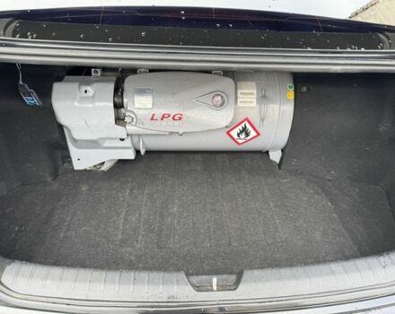 Черный Киа Оптима, объемом двигателя 2 л и пробегом 318 тыс. км за 10800 $, фото 11 на Automoto.ua