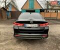 Черный Киа Оптима, объемом двигателя 2.36 л и пробегом 132 тыс. км за 10800 $, фото 3 на Automoto.ua