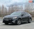 Черный Киа Оптима, объемом двигателя 2.36 л и пробегом 235 тыс. км за 11500 $, фото 1 на Automoto.ua