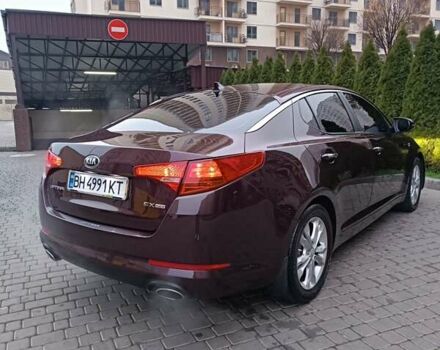 Красный Киа Оптима, объемом двигателя 2.36 л и пробегом 164 тыс. км за 10100 $, фото 4 на Automoto.ua