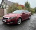 Червоний Кіа Оптіма, об'ємом двигуна 2.4 л та пробігом 320 тис. км за 6307 $, фото 1 на Automoto.ua