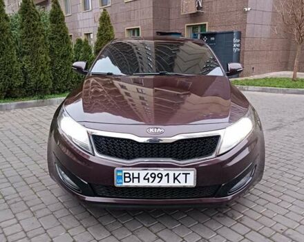 Красный Киа Оптима, объемом двигателя 2.36 л и пробегом 164 тыс. км за 10100 $, фото 1 на Automoto.ua