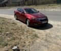 Красный Киа Оптима, объемом двигателя 2.4 л и пробегом 125 тыс. км за 6000 $, фото 1 на Automoto.ua