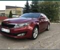 Красный Киа Оптима, объемом двигателя 2.4 л и пробегом 260 тыс. км за 8900 $, фото 1 на Automoto.ua