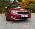 Красный Киа Оптима, объемом двигателя 2 л и пробегом 195 тыс. км за 9700 $, фото 1 на Automoto.ua