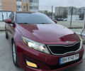 Красный Киа Оптима, объемом двигателя 2.4 л и пробегом 136 тыс. км за 9800 $, фото 1 на Automoto.ua