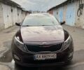 Красный Киа Оптима, объемом двигателя 2.36 л и пробегом 142 тыс. км за 10800 $, фото 1 на Automoto.ua