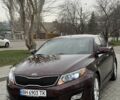 Красный Киа Оптима, объемом двигателя 2.4 л и пробегом 170 тыс. км за 9800 $, фото 1 на Automoto.ua
