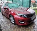 Красный Киа Оптима, объемом двигателя 2.36 л и пробегом 112 тыс. км за 10300 $, фото 1 на Automoto.ua