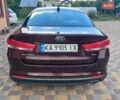 Красный Киа Оптима, объемом двигателя 2.36 л и пробегом 141 тыс. км за 10700 $, фото 10 на Automoto.ua