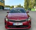 Красный Киа Оптима, объемом двигателя 2 л и пробегом 98 тыс. км за 11800 $, фото 1 на Automoto.ua