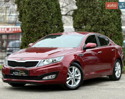 Красный Киа Оптима, объемом двигателя 2.36 л и пробегом 183 тыс. км за 8500 $, фото 1 на Automoto.ua