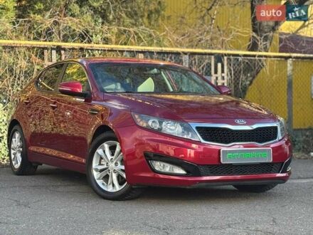 Красный Киа Оптима, объемом двигателя 2.4 л и пробегом 145 тыс. км за 9000 $, фото 1 на Automoto.ua
